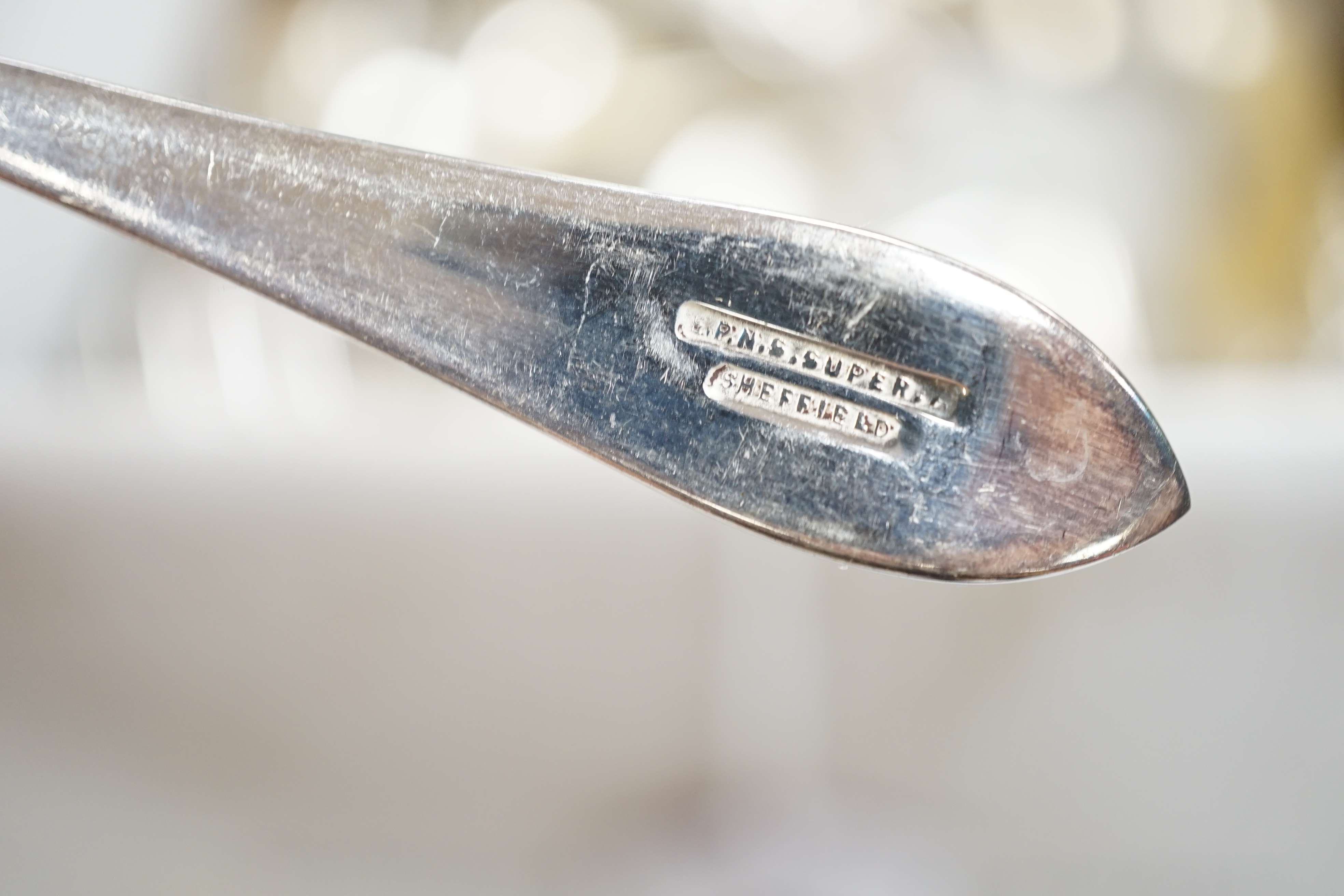 A pair of sterling pepperettes, five other sterling or 800 standard items of flatware and a quantity of silver plated flatware.